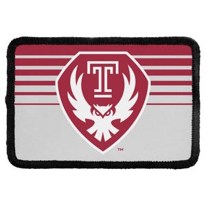May include: A rectangular patch with a black stitched border. The design features a maroon shield containing a white letter T above a stylized white owl. The background is divided into a maroon section with horizontal white stripes and a light gray base.