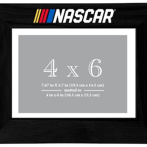May include: Black wood picture frame with a gray mat and white text that reads "NASCAR" and "4 x 6" with the measurements in inches and centimeters.