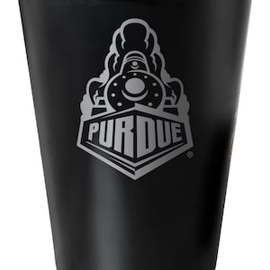 May include: Black stainless steel cup with a silver Purdue University logo featuring a train. The logo says "Purdue" with a registered trademark symbol.