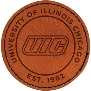 May include: A round, brown leather patch with the text "UNIVERSITY OF ILLINOIS CHICAGO" and "UIC" in a stylized font. The text "EST. 1982" is also present. The patch has a black stitched border.