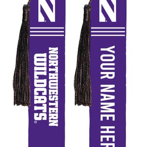 May include: Two rectangular purple bookmarks with dark brown tassels. Each features a white letter N, two horizontal lines, and white text. One reads NORTHWESTERN WILDCATS, and the other reads YOUR NAME HERE in a bold, sans-serif font style.