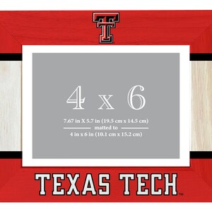 May include: A red and white wooden picture frame with a Texas Tech logo and the words "4 x 6" and "TEXAS TECH" printed on it. The frame is designed to hold a 4x6 inch photo.