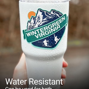 a person holding up a white cup with the words water resistant can be used for