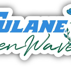 May include: A white sticker with the words "Tulane Green Wave" in blue and green. The sticker features a floral design with blue flowers and green stems. The sticker has a white border and a slight shadow.