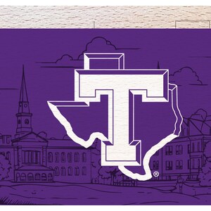 May include: Purple and white graphic featuring a stylized outline of the state of Texas with a large white letter "T" inside. The background includes a line drawing of a campus with buildings and a church steeple.