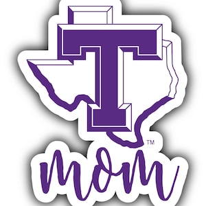 May include: Purple vinyl sticker with a stylized outline of the state of Texas and a large purple "T" inside. The word "mom" is written in cursive below the Texas outline. The sticker has a white background.