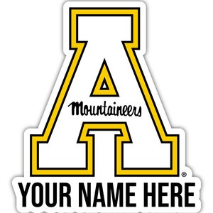 May include: A white sticker with a yellow outline of the letter A. The letter A has a smaller yellow triangle inside. The word "Mountaineers" is written in black cursive below the letter A. The text "YOUR NAME HERE" is written in black at the bottom of the sticker.