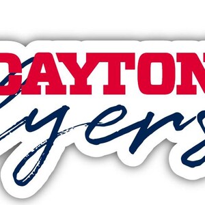 May include: A white sticker with the words "DAYTON Flyers" in red and blue. The word "Flyers" is in a cursive font. Red flowers and green leaves are on the right side of the sticker.