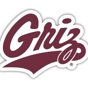 May include: A maroon and white sticker featuring the word "Griz" in a stylized, cursive font. The word is outlined in white, with a white shadow effect. The sticker has a rounded shape.
