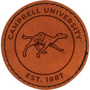 May include: A round, brown leather patch with the words "CAMPBELL UNIVERSITY" in a circular pattern. Inside the circle is a camel graphic and the text "EST. 1887". The patch has a stitched black border.