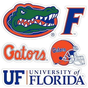 May include: A collection of University of Florida Gators stickers. Includes a green and blue alligator head, a blue 'F', the word 'Gators' in orange script, an orange football helmet, and a blue and white logo that says 'UF University of Florida'.