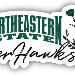 May include: A white sticker with the words "Northeastern State RiverHawks" in green and black lettering. The sticker also features a floral design with green flowers and black stems.