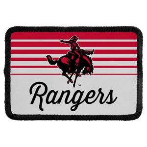 May include: A rectangular patch with a black stitched border featuring a red and white horizontal striped background. In the center, a dark red silhouette of a cowboy riding a bucking horse is displayed above the black script text Rangers.