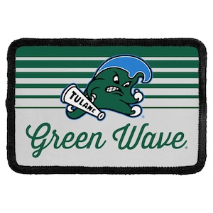 May include: A rectangular patch with a black stitched border. The design features horizontal green and white stripes, a green mascot holding a white megaphone labeled TULANE, and the text Green Wave in a green cursive script font.