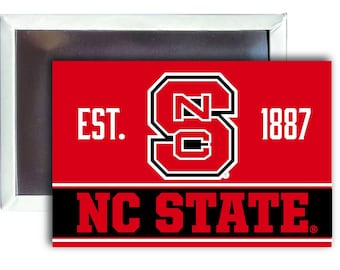 May include: A red and black magnet with the text "EST. 1887 NC STATE" and a black and white logo of a stylized "NC" inside a letter "S".