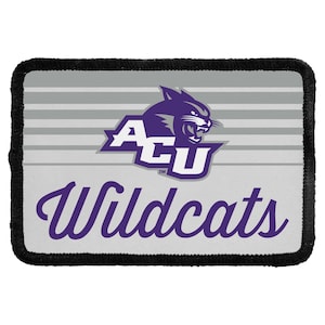 May include: A rectangular patch with a black stitched border featuring a light gray background with horizontal stripes. The center displays a purple and white ACU logo with a wildcat head above the purple cursive text that reads Wildcats.