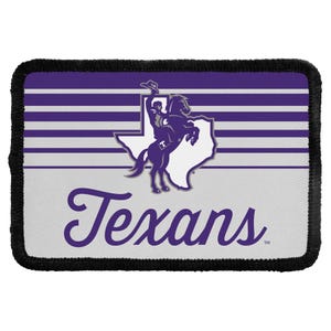 May include: A rectangular patch with a black stitched border featuring a purple and white striped background. It displays a white silhouette of the state of Texas with a purple graphic of a person riding a bucking horse and the word Texans in purple.