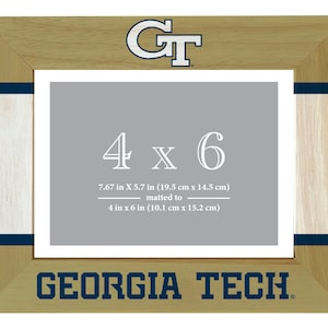 May include: A wooden picture frame with a gold and white finish. The frame features the Georgia Tech logo and the text "Georgia Tech". The frame is designed to hold a 4x6 inch photo, which is matted to 7.67x5.7 inches.