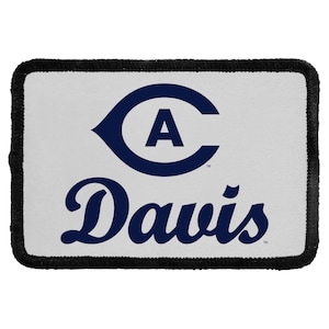 May include: A rectangular patch with a white background and a black stitched border. The design features a dark blue letter A enclosed within a dark blue C-shaped graphic, with the word Davis written in dark blue script lettering below it.