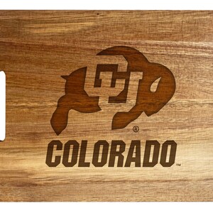 May include: Wooden cutting board with a brown buffalo silhouette and the text "COLORADO" in brown lettering.