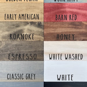 May include: A wood stain colour chart with 12 different wood stain colours. The colours are: Golden Pecan, Worn Navy, Early American, Barn Red, Roanoke, Honey, Espresso, White Washed, Classic Grey, White, Weathered Grey, and Black.