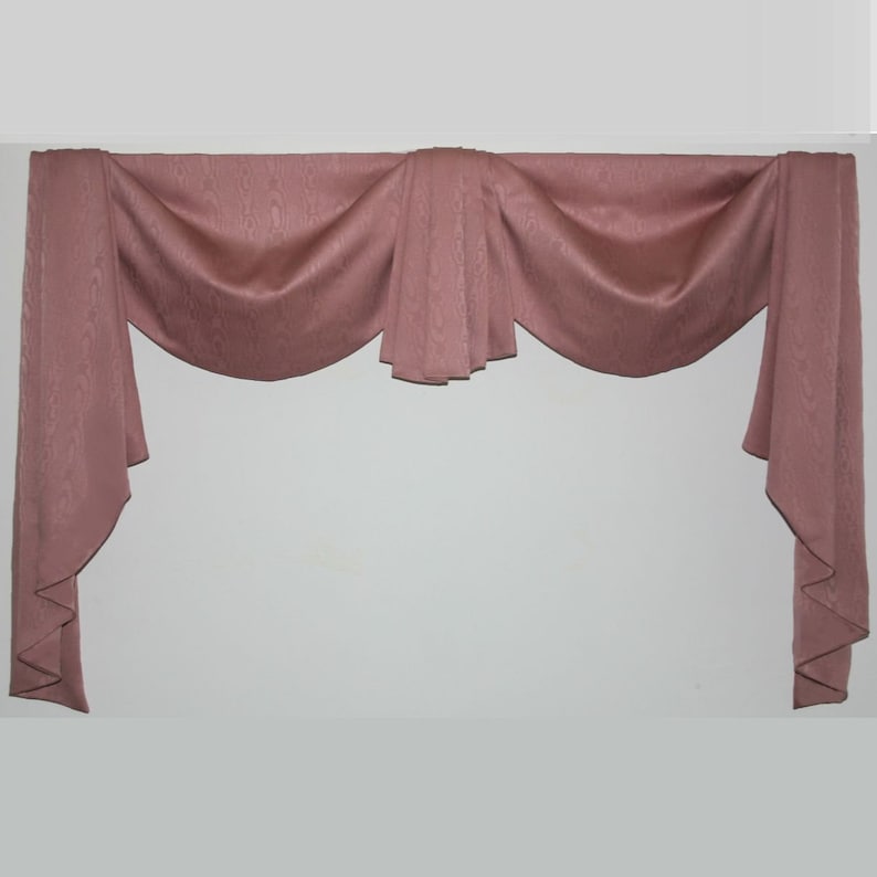 This elegant valance features tucked swoops separated with fan folded circular jabots separating the swoops.  Flared cascades complete each side and drop to a maximum length of 37".  The valance is board  mounted.