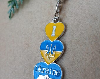 Ukrainischer Schlüsselanhänger mit blau-gelber Flagge der Ukraine. Ukrainische Souvenir Silber. УKRїnat I Love Ukraine