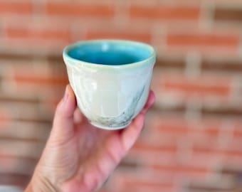 Handmade Ceramic Espresso Cup: Japanese Minimalist Design, handheld with a dimple