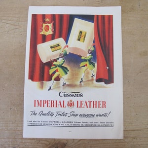 May include: A vintage advertisement for Cussons Imperial Leather soap. Two figures in green and yellow costumes hold bars of soap in front of a red curtain. The text reads "Cussons Imperial Leather The Quality Toilet Soap everyone wants!"