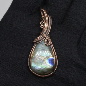 Wildly colored labradorite oval pendant in oxidized pure copper
