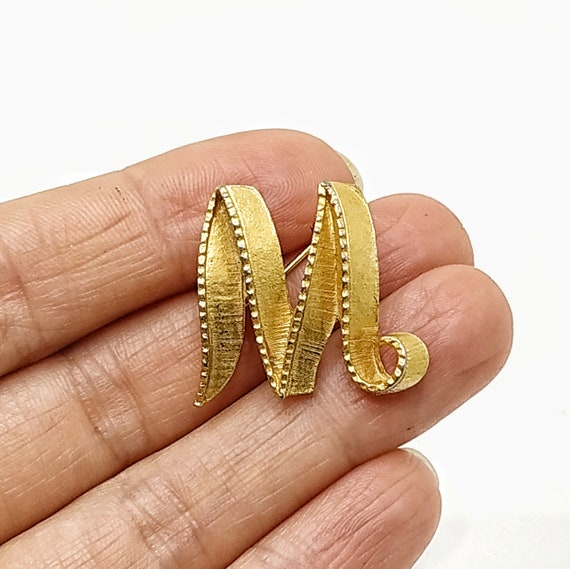 M brooch clearance