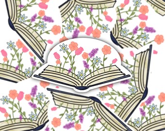 May include: An open book with pink, orange, and purple flowers growing out of it. The book is surrounded by other open books with flowers growing out of them.
