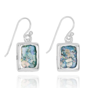 May include: A pair of silver dangle earrings with rectangular blue and green Roman glass inlays. The earrings have a 925 stamp on the back.