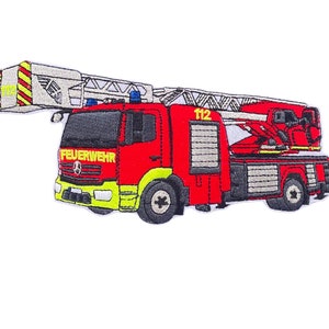 May include: Red and yellow embroidered patch of a fire engine with a ladder, the words "FEUERWEHR" and "112" are visible.