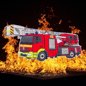 May include: Red and white embroidered patch of a fire engine with a ladder, the words "FEUERWEHR" and "112" are visible on the engine.