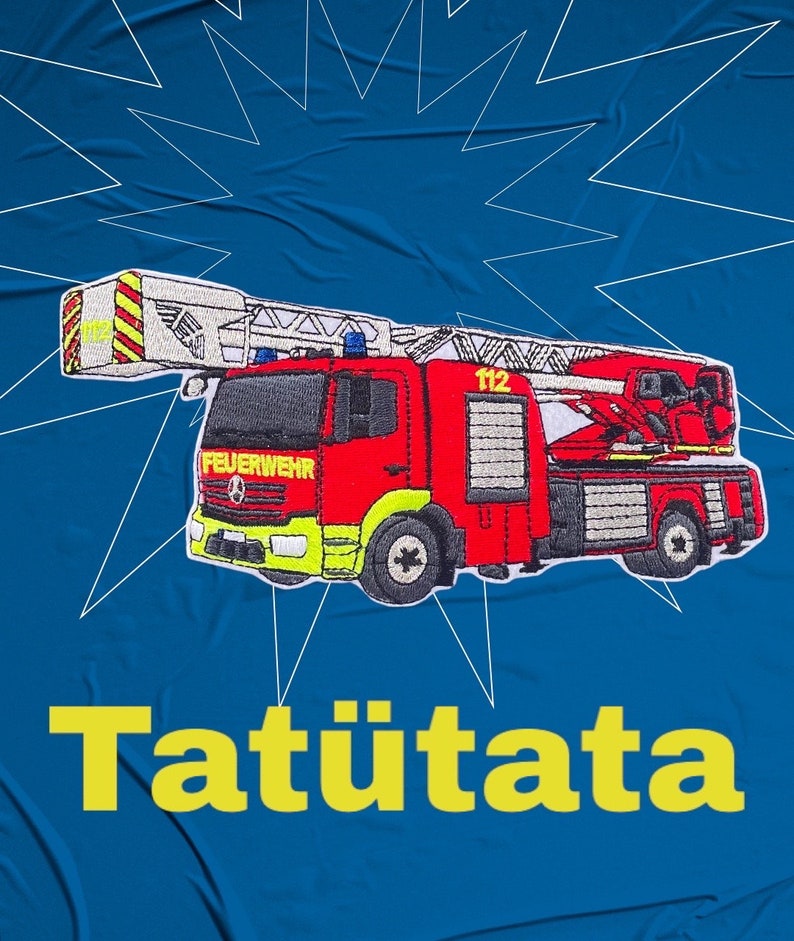 May include: A red and white fire engine with a ladder, the words "Feuerwehr" and "112" on the side, and the word "Tat&uuml;tata" in yellow letters below the engine.