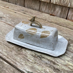 hand built stoneware butter dish in neutral tones with oak leaf pattern.