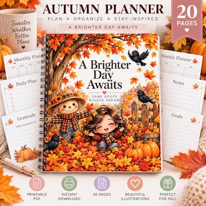 May include: A spiral-bound autumn planner with 20 pages featuring a cover illustration of a scarecrow and a child sitting in orange and red fall leaves. The text reads A Brighter Day Awaits and Same Roots Bigger Dreams. Includes interior page layouts for monthly, weekly, daily planning, notes, and goals.