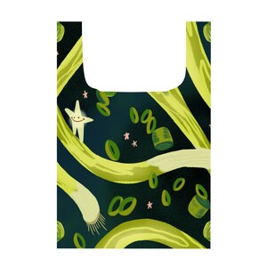 May include: A green reusable grocery bag with a pattern of green onions, green onion rings, and stars on a dark blue background.
