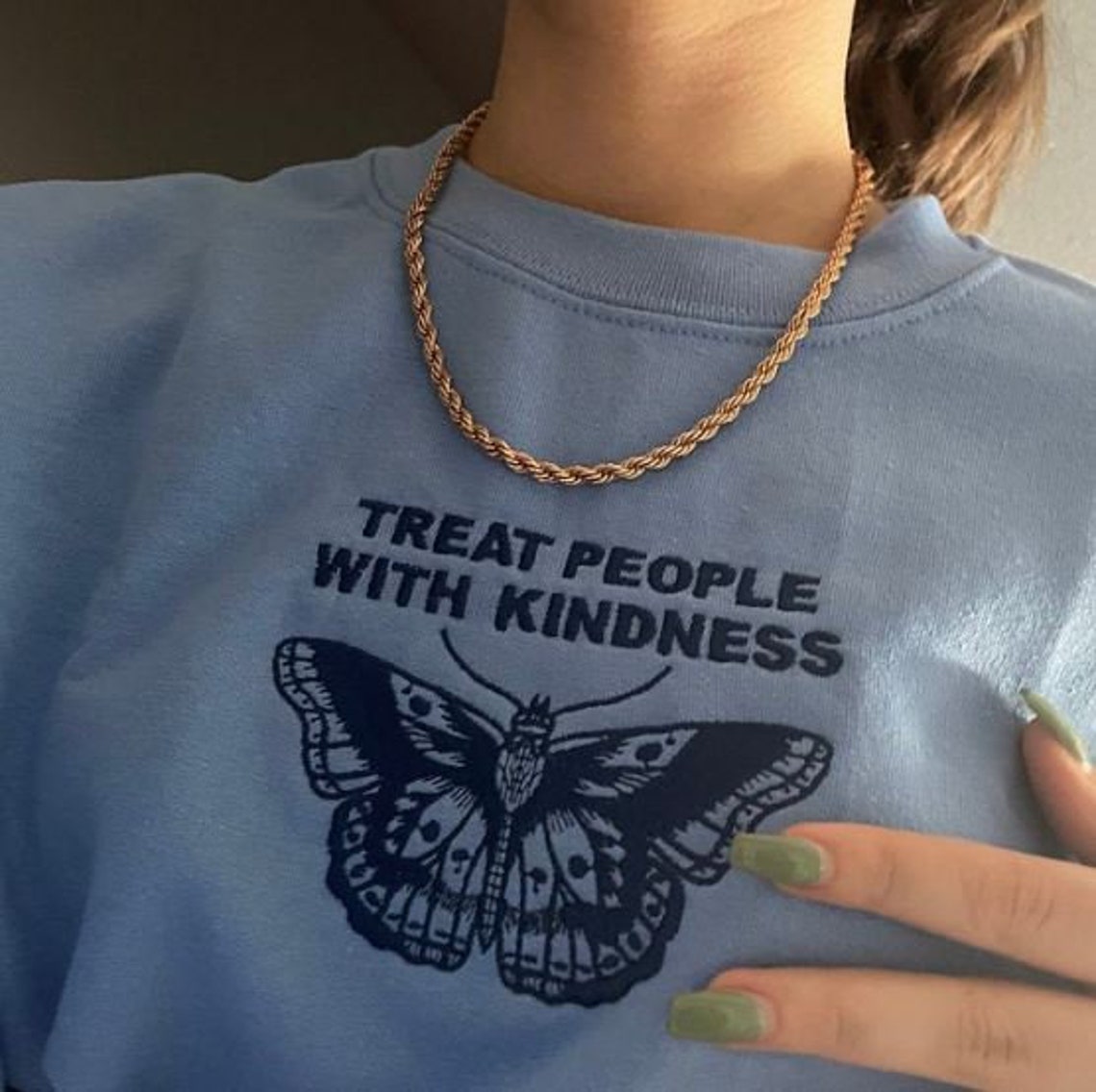 white sweater with blue butterfly