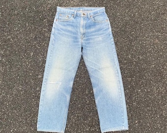 vintage Levi's 505 Jeans W32 denim délavé léger effet vieilli fabriqué aux États-Unis jambe droite bleu délavé