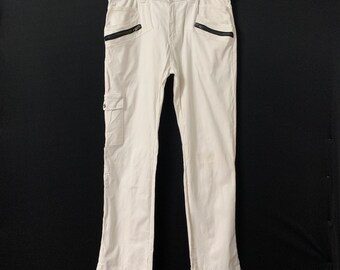 Pantaloni da golf vintage Common con vita elasticizzata e tasche con cerniera.
