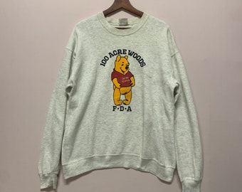 Felpa girocollo vintage con grafica di Winnie the Pooh e orsetto.