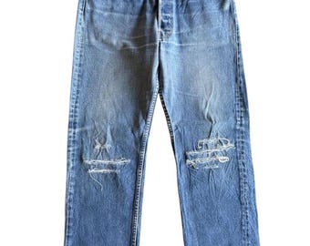 Jeans Levi’s 501 Distressed Denim anni '80, rari, vintage, con bottone superiore stampato 524, Made in USA, taglio dritto, pantaloni da uomo blu lavati.