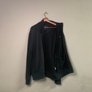 May include: A rustic wooden sign with the text "Welcome to our home" in white lettering. The sign features a distressed finish and a simple, inviting design, perfect for entryway decor.