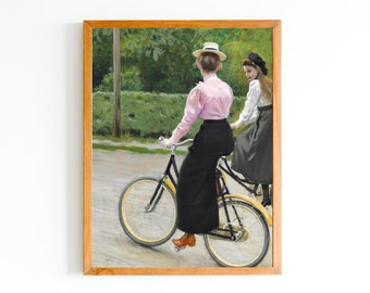 May include: Two people riding a bicycle on a dirt road. The person in the front is wearing a pink shirt, a black skirt, and a straw hat. The person in the back is wearing a white shirt, a black skirt, and a black hat.