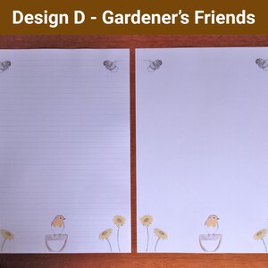 May include: Two sheets of white stationery with a garden theme. Each sheet has illustrations of bees at the top. The bottom of each sheet features a robin on a bird bath, with sunflowers. The text "Design D - Gardener's Friends" is at the top.