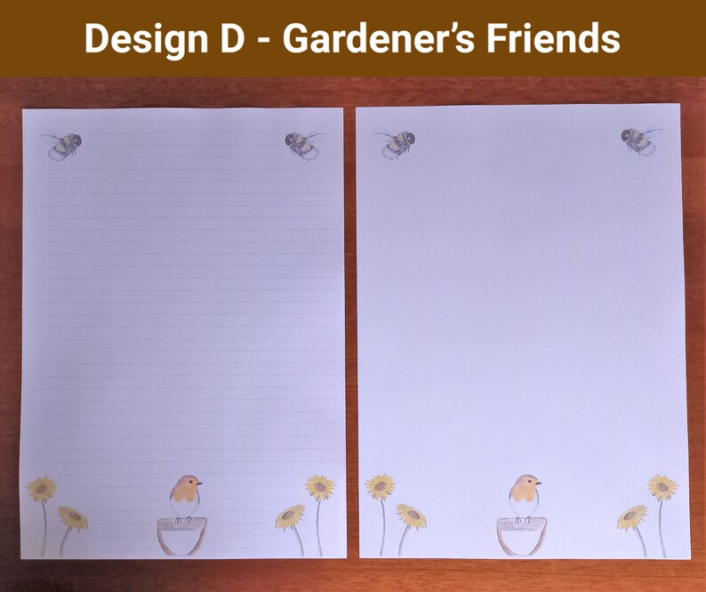 May include: Two sheets of white stationery with a garden theme. Each sheet has illustrations of bees at the top. The bottom of each sheet features a robin on a bird bath, with sunflowers. The text "Design D - Gardener's Friends" is at the top.