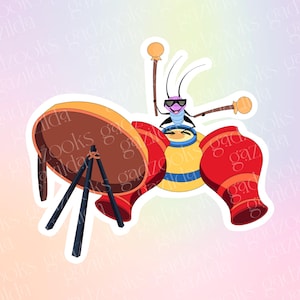 May include: A sticker featuring a cartoon cricket wearing black sunglasses and playing a drum set. The cricket holds two drumsticks, positioned behind a yellow drum, flanked by two red drums, and a large brown circular drum on a black tripod stand.