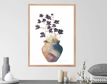 May include: A watercolor illustration of a dark purple flower arrangement in a brown and blue ceramic vase. The vase has a mottled, textured surface. The artwork is framed in a light wood frame.